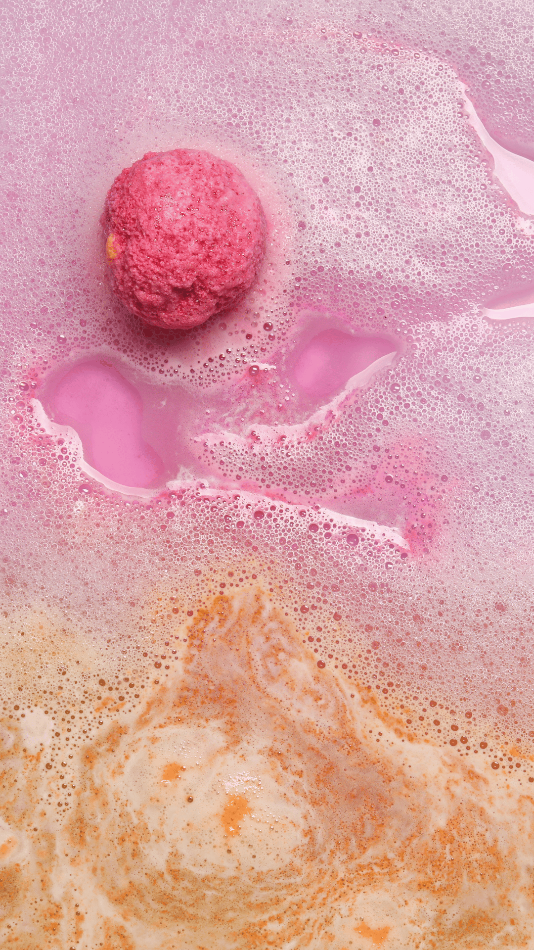 A vibrant purple Aliens Bath Bomb by Scented Aromas, with yellow accents, reminiscent of the iconic fragrance, set against a colorful, bubbly backdrop.