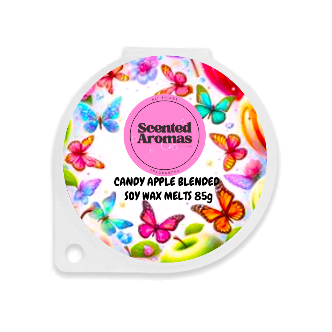 The round packaging showcases a pink-labeled "Scented Aromas" design with vibrant butterflies, featuring "Candy Apple Wax Melts 85g," offering premium UK blended soy wax melts for a delightful experience.