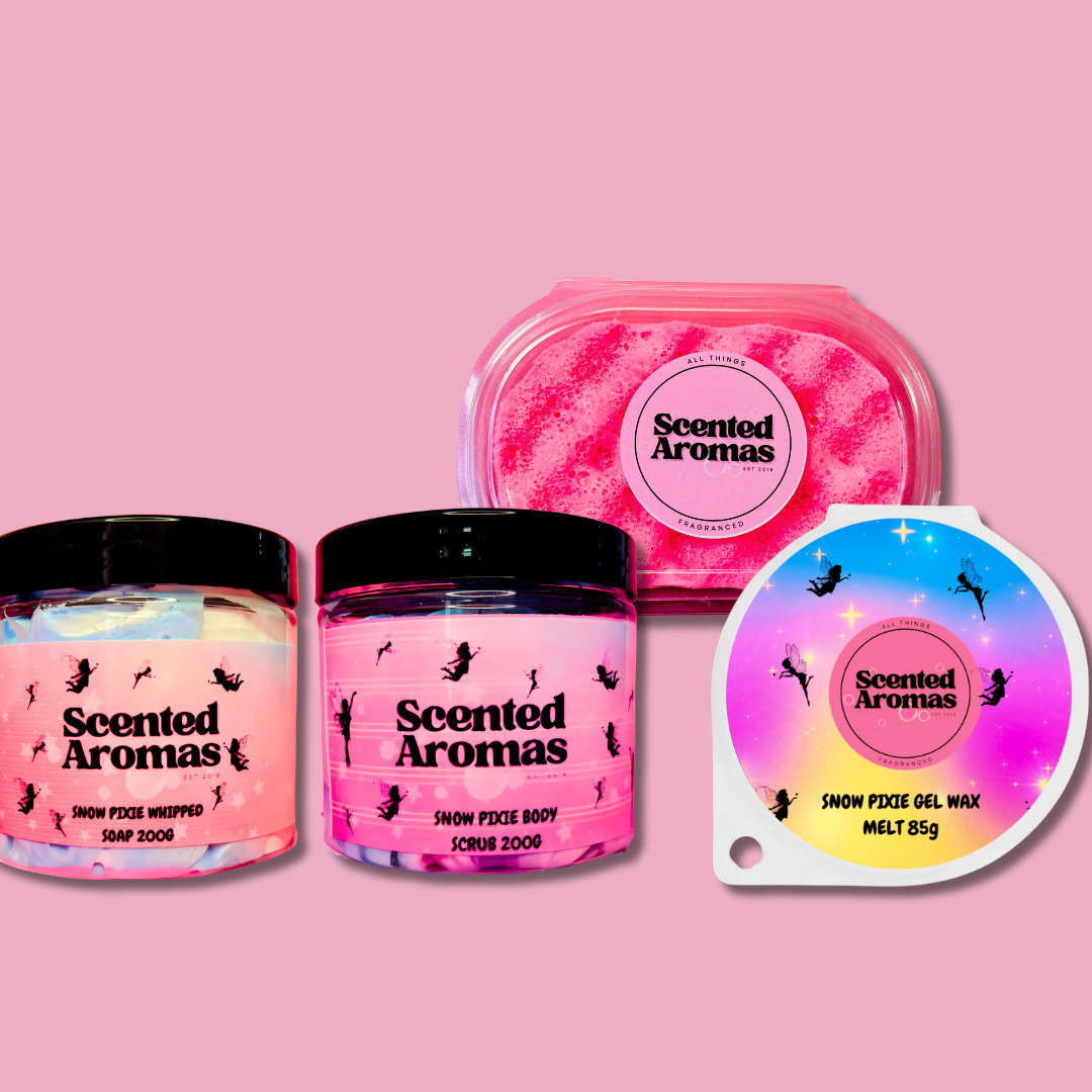 Discover Scented Aromas' Snow Pixie Fragrance Bundle featuring four pink products—whipped soap, scrub, soap bar, and wax melt—set against a pink background. Enchanting winter scent for £29.50.