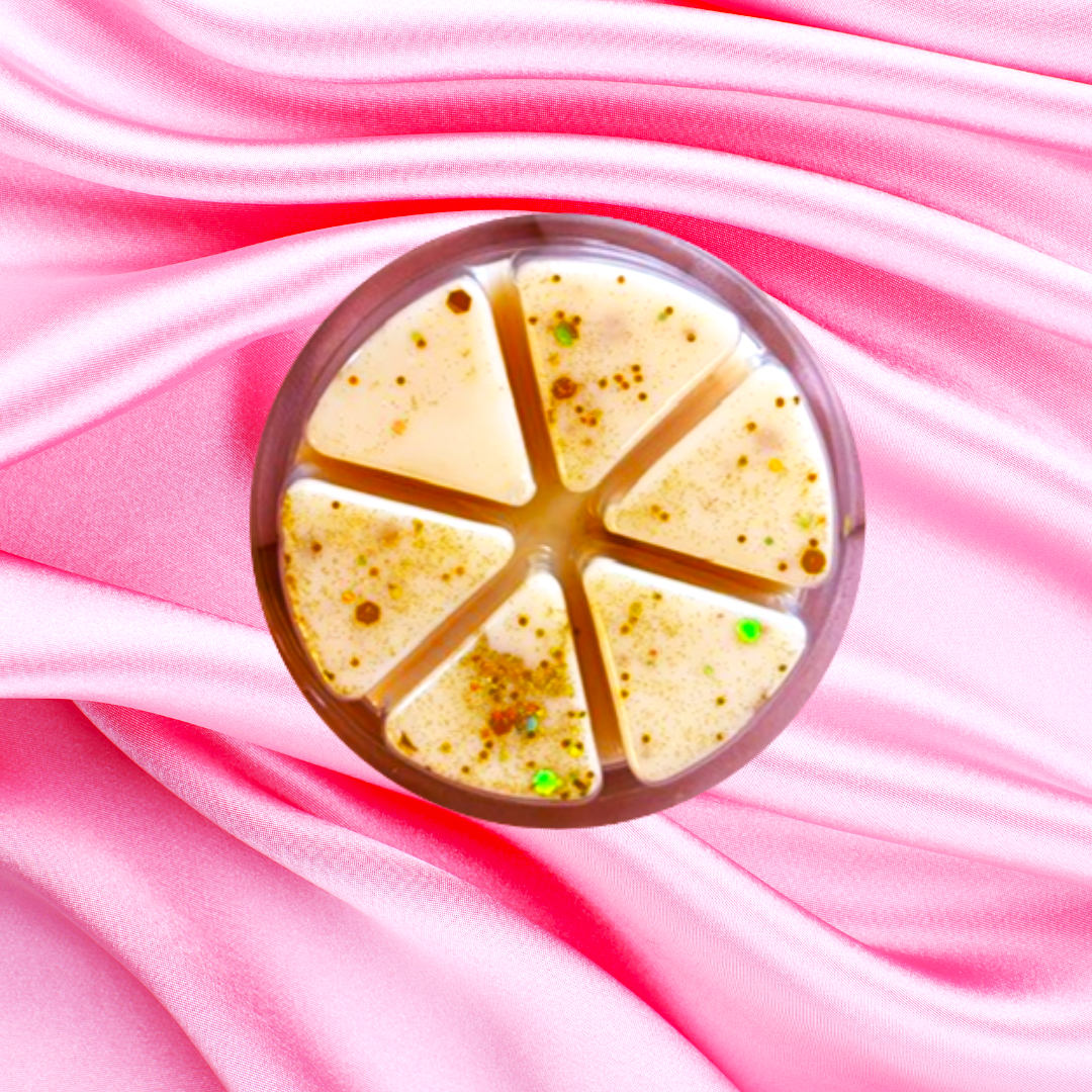 A round bubble tea in a divided plastic cup sits on pink satin, capturing the essence of The Soap Gal x's Almond Milk & Honey Luxury Wax Melts, 85g.