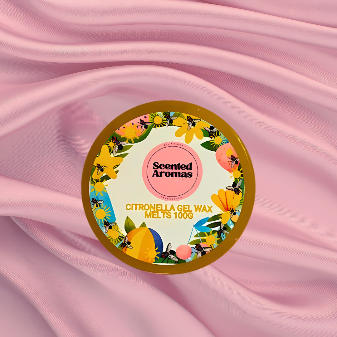A round tin of Citronella Bug Repellent Gel Wax Melts by The Soap Gal x, 100g, rests on a pink fabric background. Infused with essential oils, its floral and lemon design delights while naturally repelling mosquitoes.