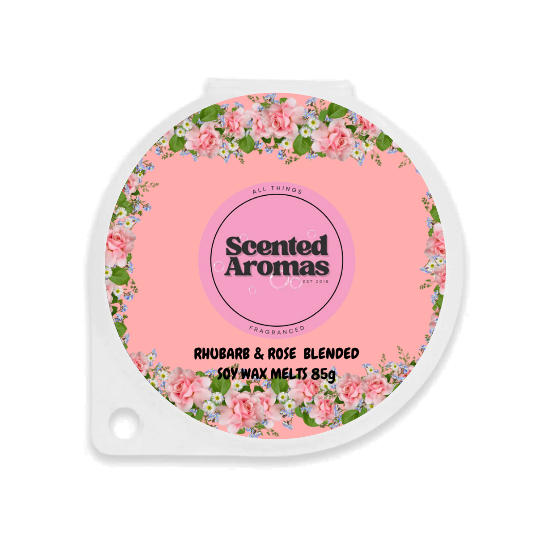 The pink label on The Soap Gal x's package of Rhubarb and Rose Wax Melt 85g features "Scented Aromas" and a floral design. This wax melt is crafted from a rich soy wax blend, ensuring a long-lasting fragrance.