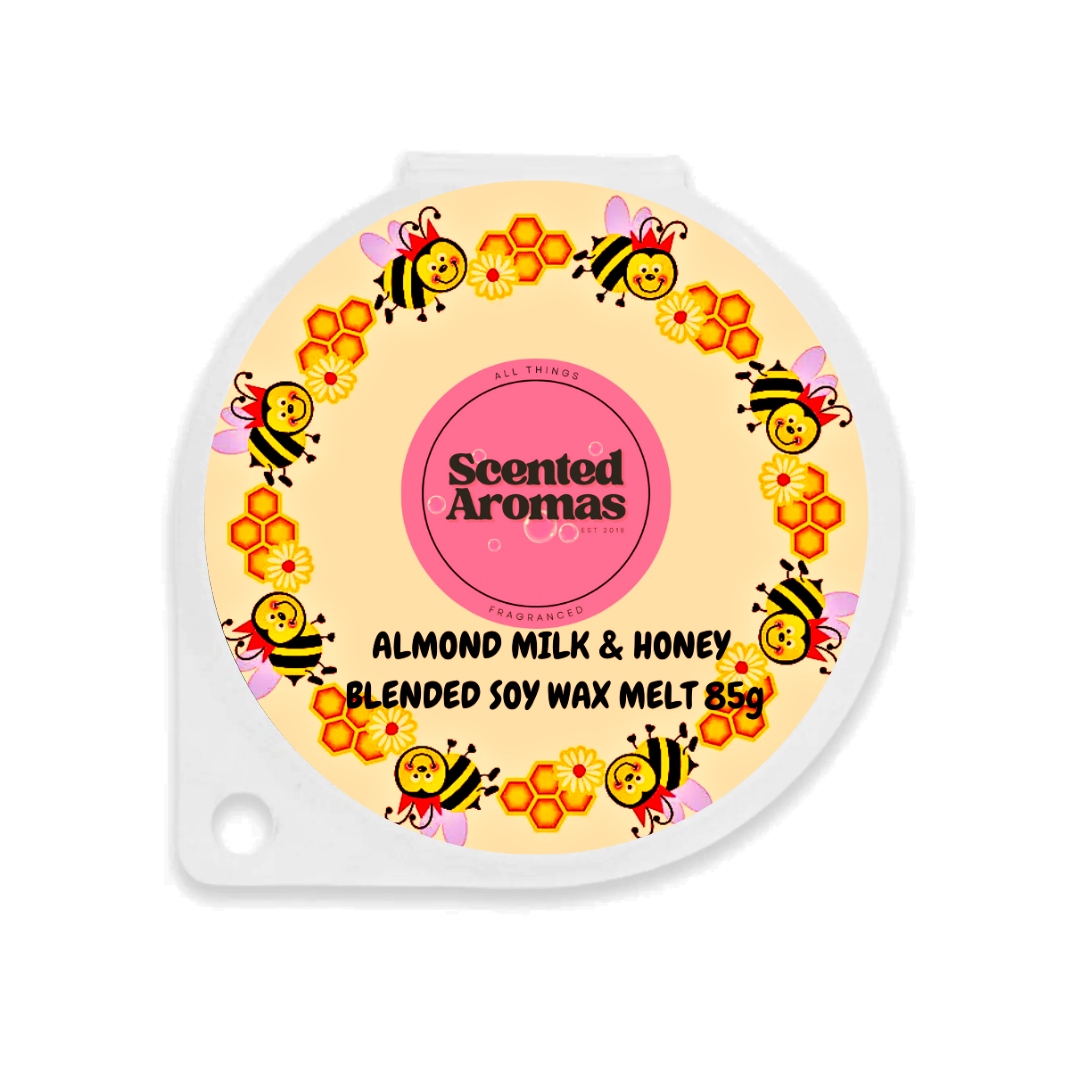 The Soap Gal x offers round wax melt packaging with bee and honeycomb designs labeled "Scented Aromas: Luxury Wax Melt." Fragrance: Almond Milk & Honey, 85g. Ideal for elevating your home fragrance experience.