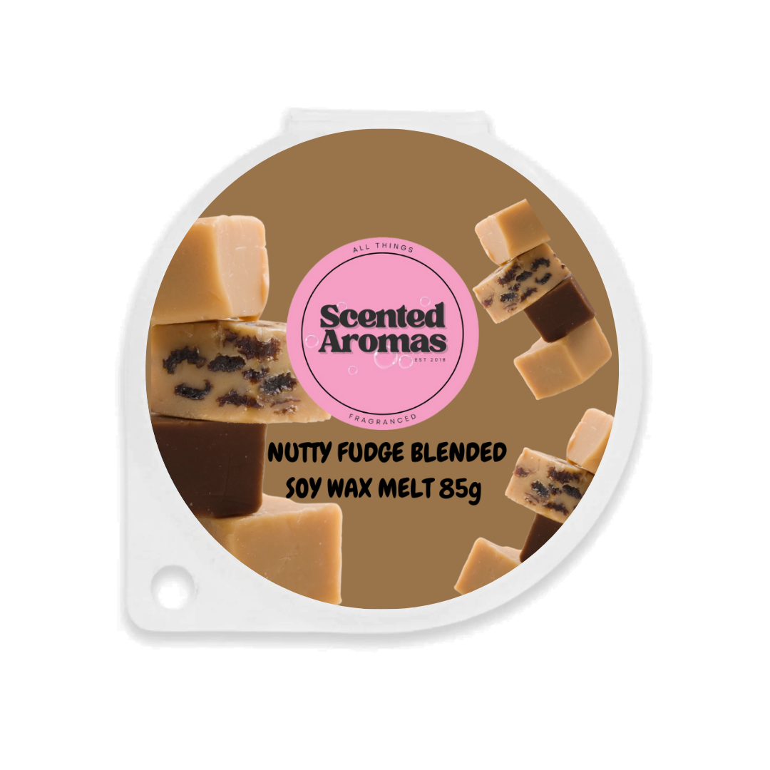 Round packaging labeled "The Soap Gal x" features nutty fudge images. Text reads: "Nutty Fudge Wax Melt 85g," offering a sweet fragrance to enchant your space.